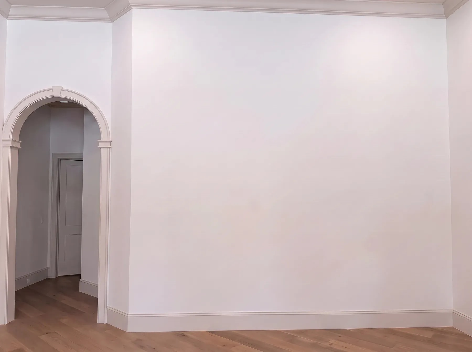 Stone Chimney & Arched Built-Ins before the installation: the original blank wall