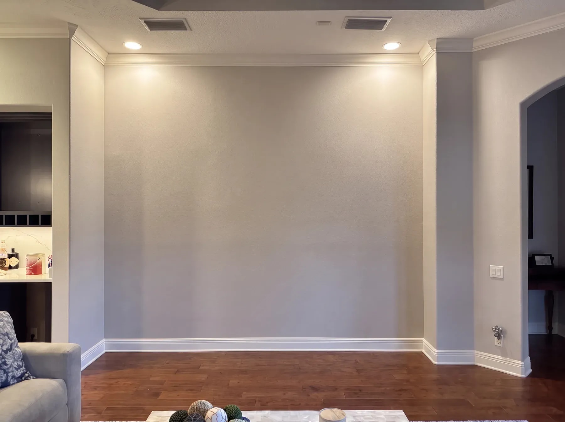 Stacked Stone & Floating Shelves before the installation: the original blank wall